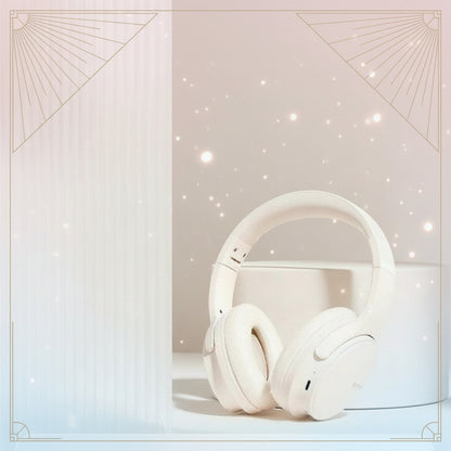White headphones on a white surface with a light gray background