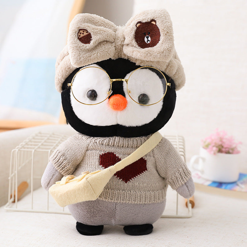 Adorable peluche pingouin travesti