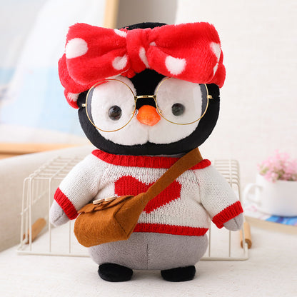 Adorable peluche pingouin travesti