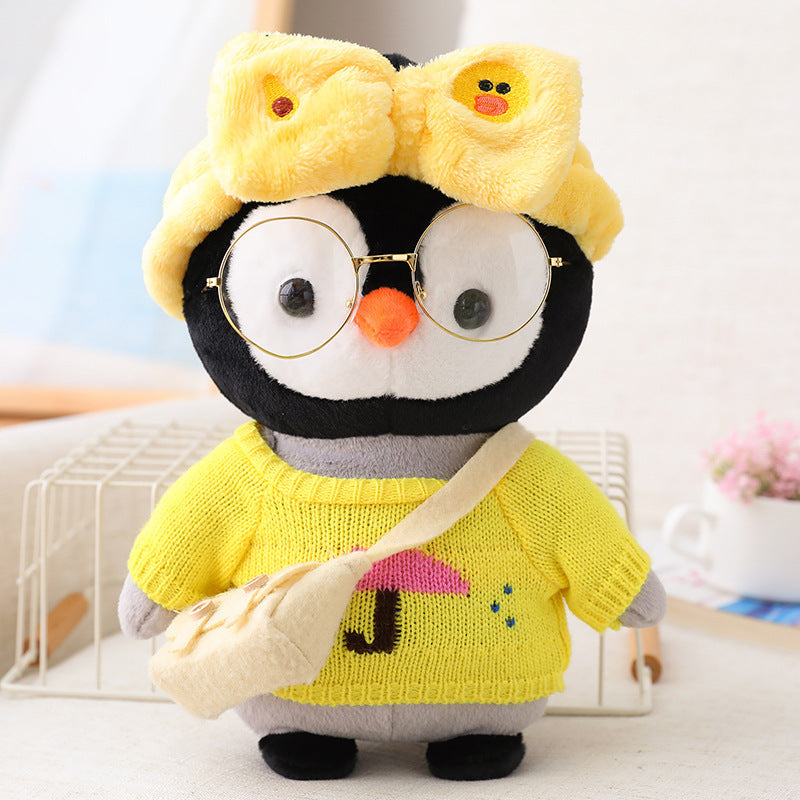 Adorable peluche pingouin travesti