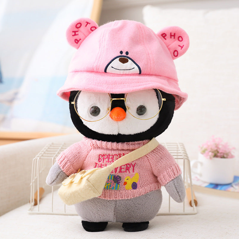 Adorable peluche pingouin travesti
