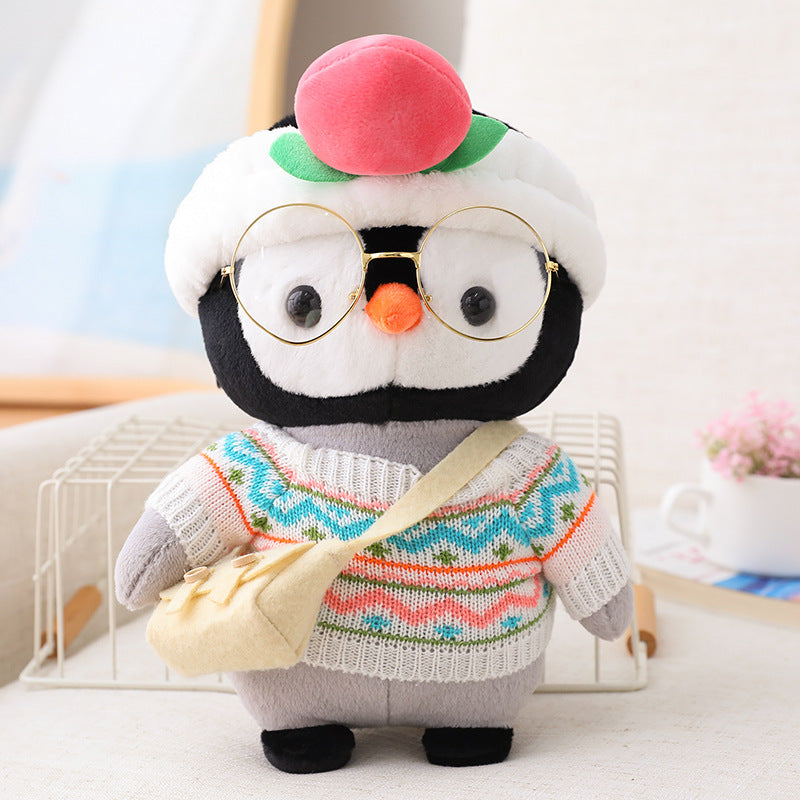Adorable peluche pingouin travesti
