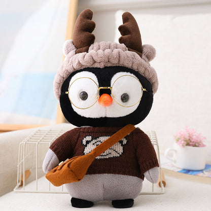 Adorable peluche pingouin travesti