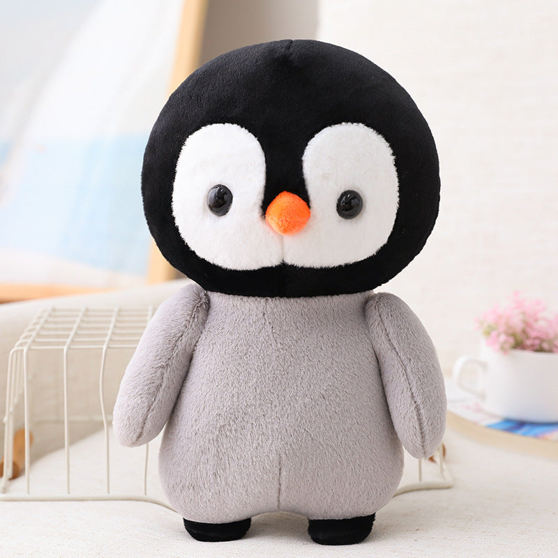 Adorable peluche pingouin travesti