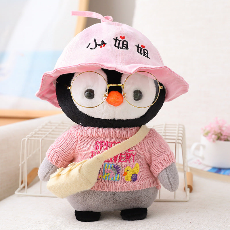 Adorable peluche pingouin travesti